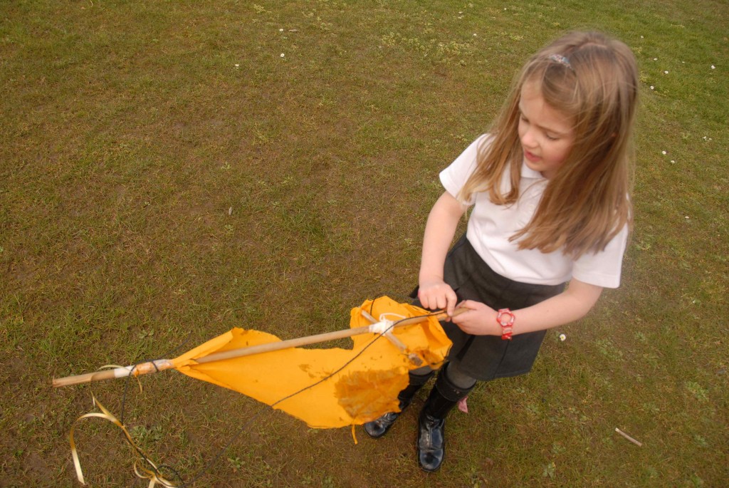 Holly has a look at the damage to the kite...