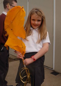 Even though the kite was now ragged by the wind, Holly was persuaded to smile!