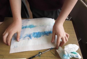 Texture and different effects were created by using tissue paper to 'mop' up the paint.......